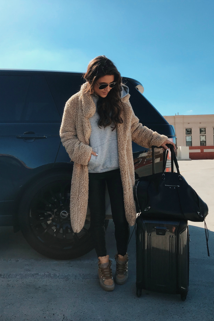 travel style faux fur coat tumi luggage leather leggings